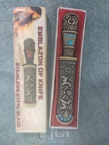 A handmade antique dagger, ivory inlaid with stones, handmade