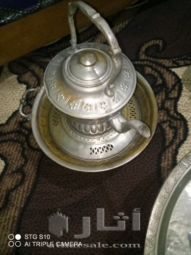 اواني منزلية قديمة من الفضة والنحاس