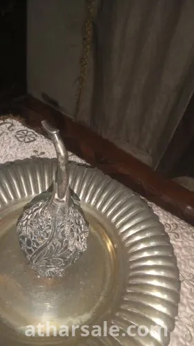 زجاجه عطر من النحاس والفضة