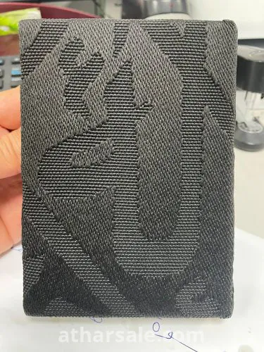 مصحف مجلد بكسوة الكعبة الملبوسة لعام 1434 هجريا ويوجد شهادة توثيق بذلك