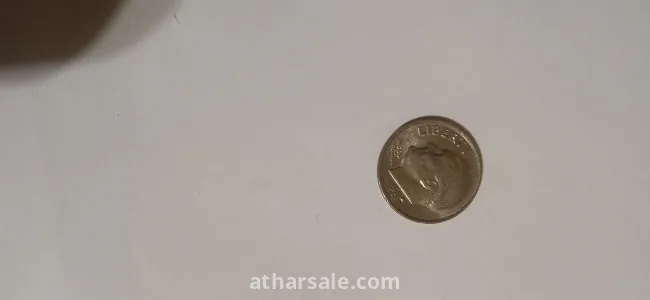 Old American coins, 1 cent release Date 1980 , another one cent release date 1982 and 5 cent release date 1988