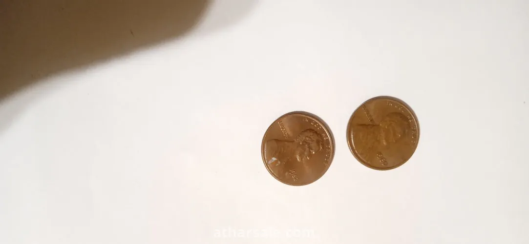 Old American coins, 1 cent release Date 1980 , another one cent release date 1982 and 5 cent release date 1988