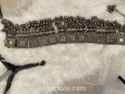 An old silver belt containing a collection of a quarter riyal dated 1354 3