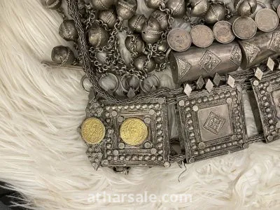 An old silver belt containing a collection of a quarter riyal dated 1354 7