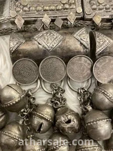 An old silver belt containing a collection of a quarter riyal dated 1354 8