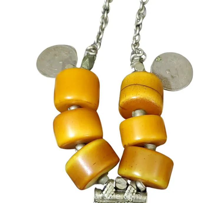 Antique necklaces decorated with antique bakelite beads. Necklaces are about 100 years old.