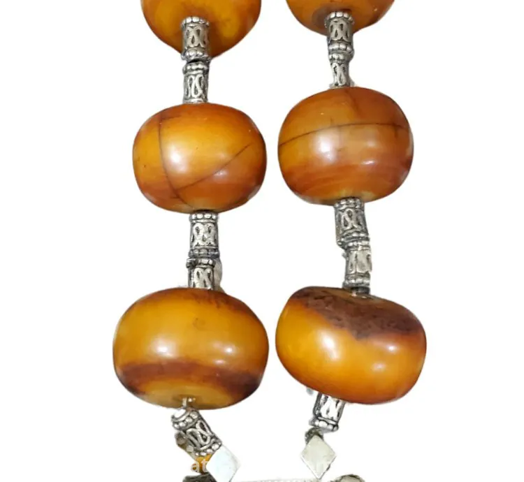 Antique necklaces decorated with antique bakelite beads. Necklaces are about 100 years old.