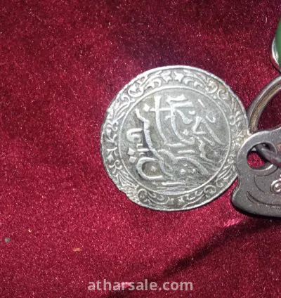 عملة مكتوب فيها أية كرسي