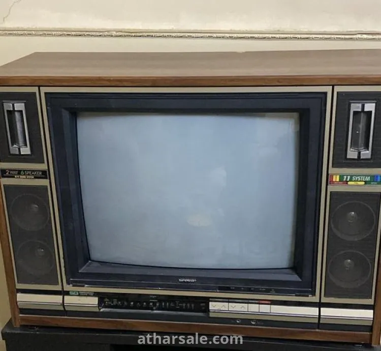 تلفزيون خشبي نوع شارب قديم بحاله ممتازه