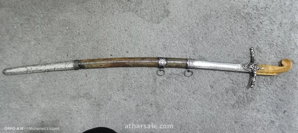 Sword Type: Heavy Cavalry Sabre, the renowned Model 1822.  Country of Origin: France - the prestigious Klingenthal factory.  Era: First half of the 19th century (circa 1823-1835).  Blade: A long, original steel blade (over one meter long), featuring a fuller groove for balance and rigidity. The blade is in excellent condition and retains its original flexibility.  Stamps and Marks: The sword bears four historical stamps confirming its authenticity and quality:  The Balance Stamp: The emblem of